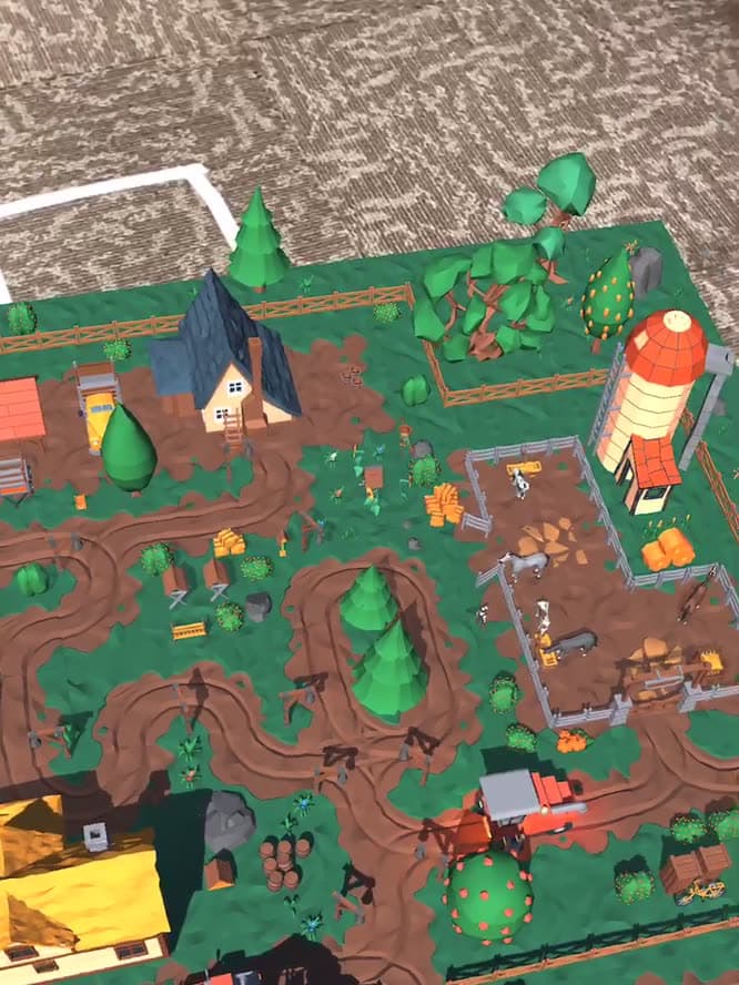 A low-poly farm placed in augmented reality on an office carpet